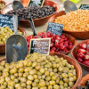 A colorful selection of olives, fava beans and peppers, look great for aperitifs