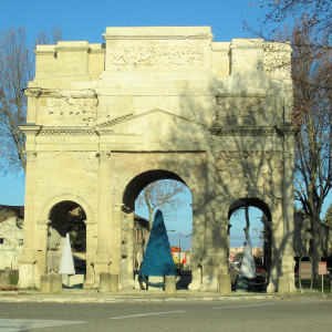 The Arc de Triomphe in Provence decorated for Christmas (Christmas tree in the middle arch)