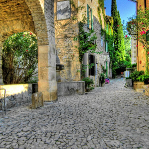 A beautiful cobble stone street lined with stone houses in the village of Seguret