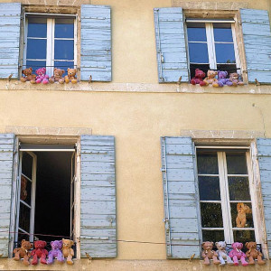 The usual window boxes overflowing with flowers replaced by bears at this village house in St Remy de Provence