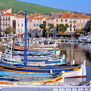 Provence - La Ciotat - Looking over colorful boats anchored in the harbor towards the pretty little village