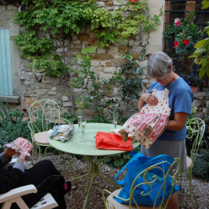 Relaxing on the patio with a glass of Sablet wine after a day at a Provence market by Margaret  Dennis