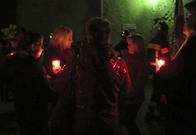 Christmas in Provence - St Barbe's Feast, Sablet - After the benediction - villagers gather outside the church and prepare for the procession to the village hall Christmas in Provence - St Barbe's Feast, Sablet - After the benediction - villagers gather outside the church and prepare for the procession to the village hall
